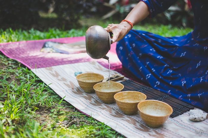 girl pouring tea from a teapot