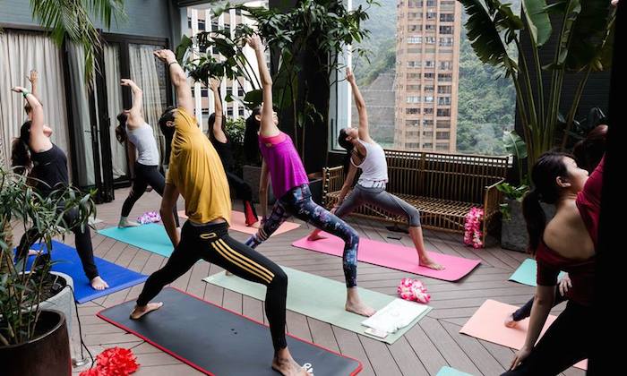 Yoga session on Mahalo Tiki Lounge rooftop