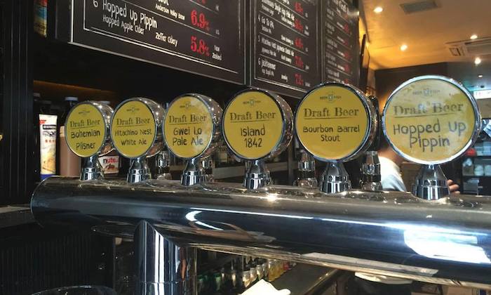 beer taps with a selection of beers
