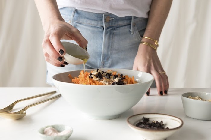 a girl making a salad