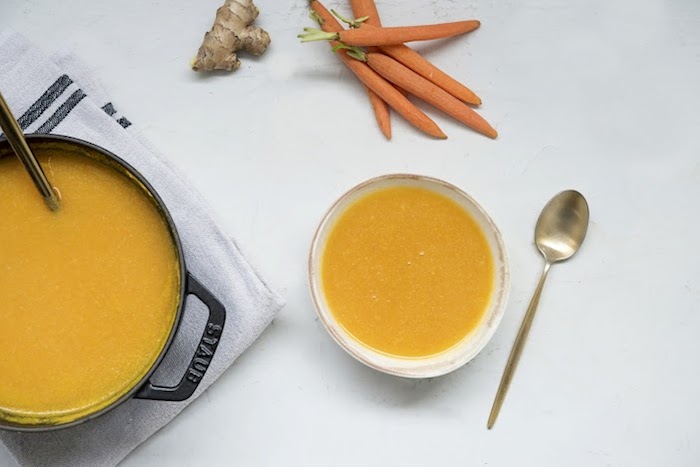 ingredients for carrot soup on a table 