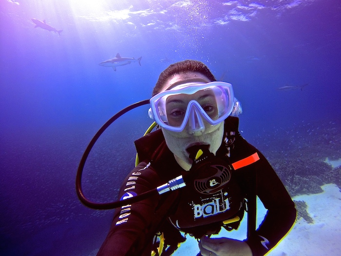 scuba diver taking a picture with a shark