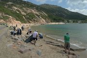 people cleaning up the beach in hong kong