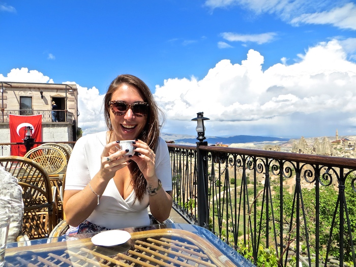 a girl having coffee in cappadocia turkey