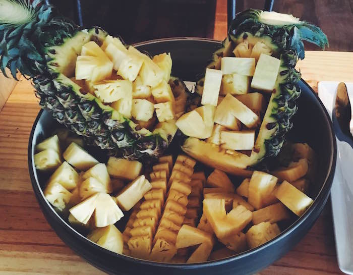 a bowl of pineapple at metzo's bar and bistro