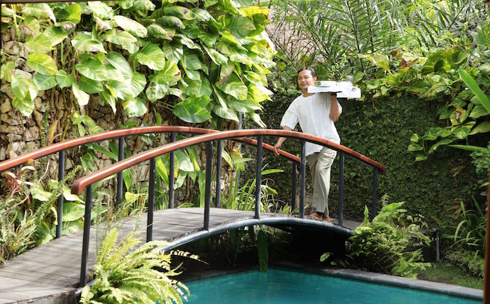 man on a bridge at the pavilions sanur