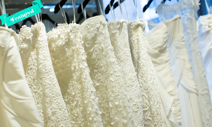white wedding dresses on a rack