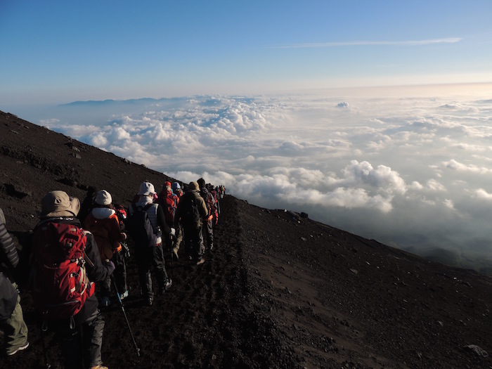 people summiting mount fuji