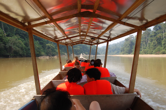 people in a river boat