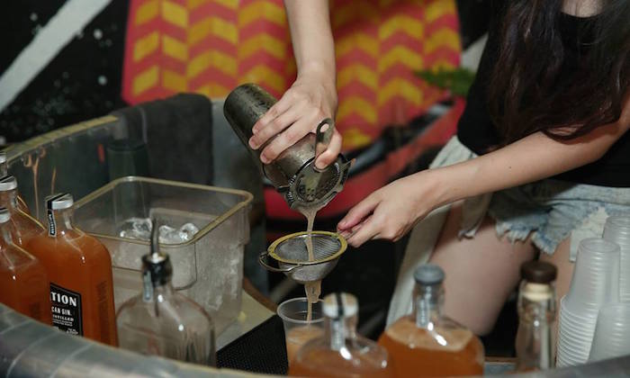 woman pouring drinks