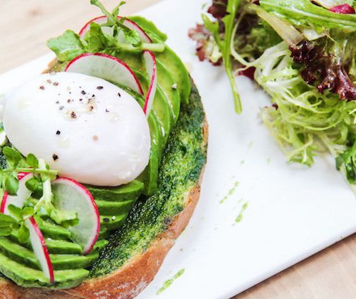 avocado on toast and poached egg at elephant grounds