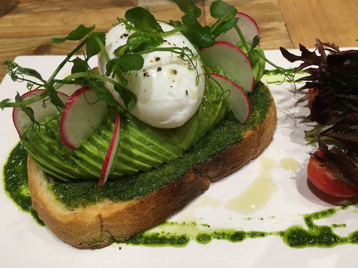 avocado on toast with a poached eggs at elephant ground