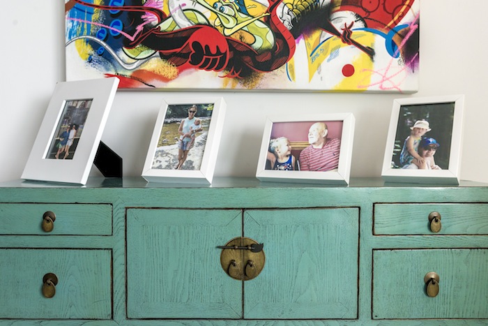 turquoise cupboard and colourful painting