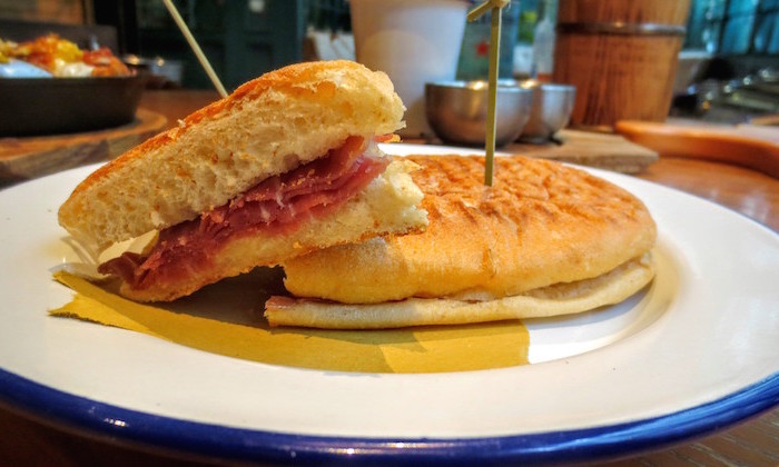 cibatta sandwich at the optimist with serrano ham and manchego cheese