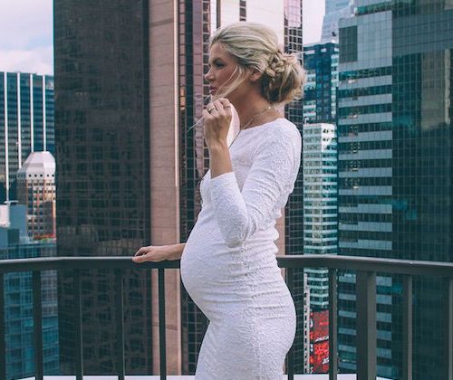 pregnant woman against the city scape