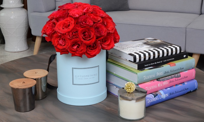 roses and books on a coffee table
