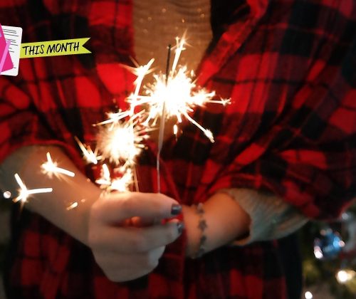 girl holding sparkler