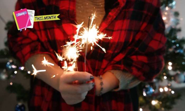 girl holding sparkler