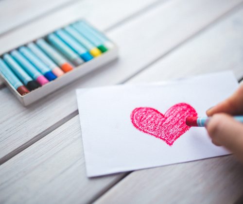 red heart drawn in crayon