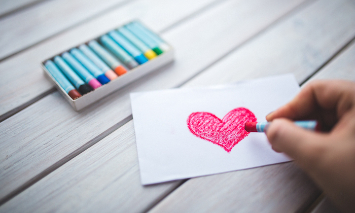 red heart drawn in crayon