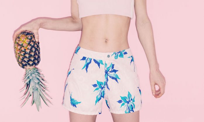 girl holding pineapple