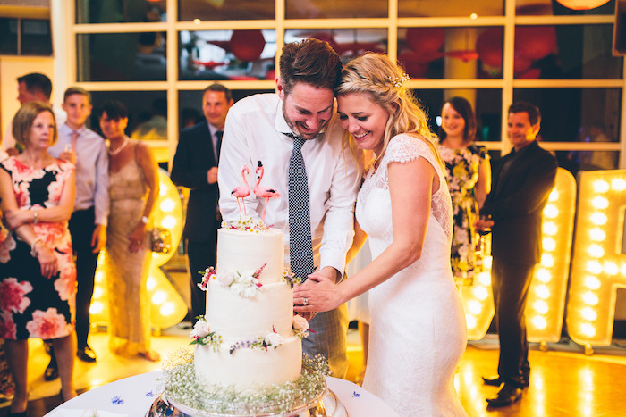 couple cutting the cake at their wedding