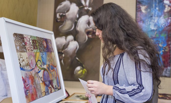 woman looking at art