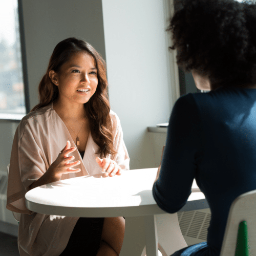 Redundancy guide: Girl talking to colleague