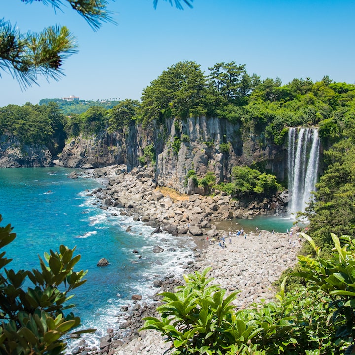 jeongbang waterfall jeju island beach quick weekend getaway from hong kong