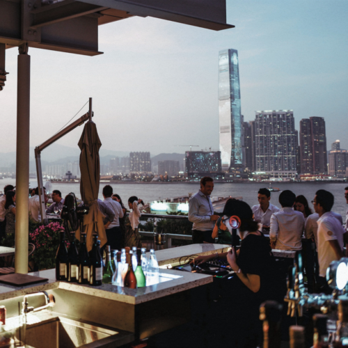 hong kong restaurant on a rooftop with skyline view and outdoor terrace