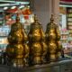 Three traditional Chinese herbal tea containers placed in front of Herbal shop