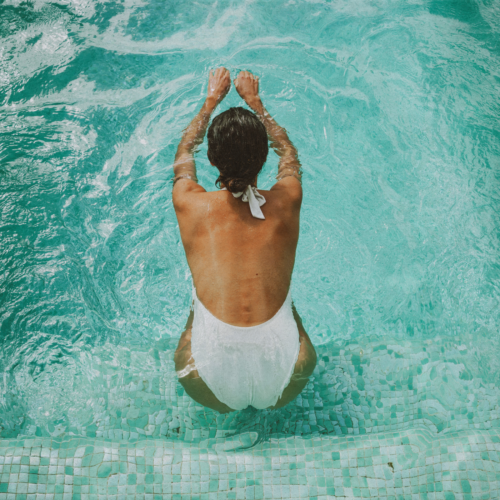 woman in a hotel swimming pool in hong kong