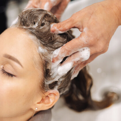 woman getting a hair wash and scalp massage, hair treatment, at a hair spa salon in Hong Kong