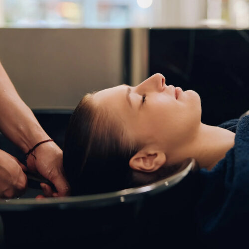 woman getting her hair treated at shhh hair spa hong kong, best hair spas in hong kong for scalp treatments, head massages and more