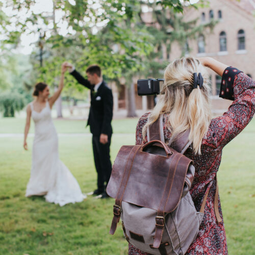 Wedding photographer taking a picture of a couple on their wedding day outdoors, best wedding photography and event photography services in Hong Kong