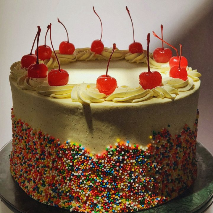 vission bakery custom birthday cake with sprinkles and cherries