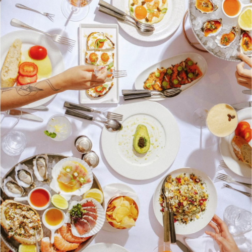 selection of dishes on a table from a birds-eye view from LPM Hong Kong's weekend brunch, available summer 2026