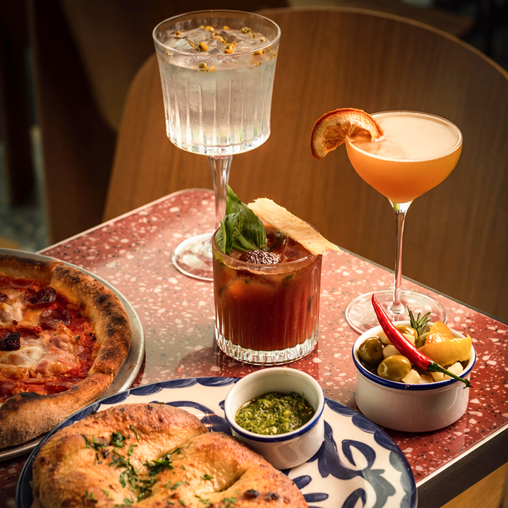 pizzas and cocktails at new Emmer Pizza location in Hong Kong International Airport in july 2026