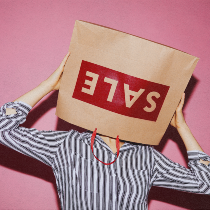 woman with a sale bag on her head representing major sales in hong kong this summer