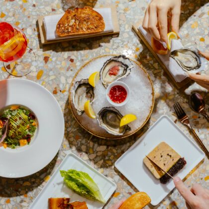 selection of dishes on a table from a birds-eye view from Louise Hong Kong's weekend brunch, available autumn 2026