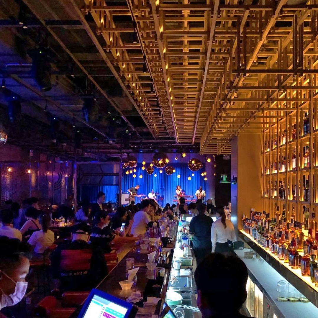 interior of LAVO bar in shenzhen with disco balls and a live band playing on stage