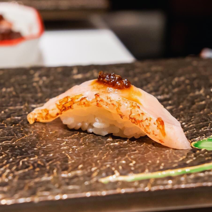 piece of sushi on omakase counter from sushi sakai hong kong