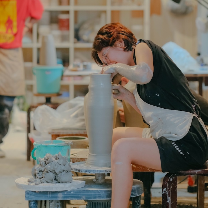 woman doing pottery at a pottery studio in hong kong