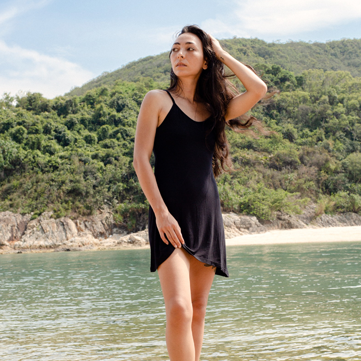 woman outside in a little black dress from plantdays sustainable fashion brand eco-friendly clothing collection in hong kong