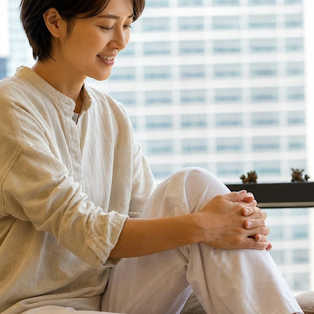 woman looking blissful at a wellness event in hong kong