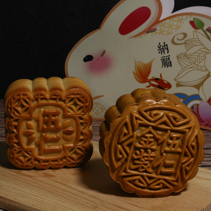 mooncakes on a cutting board and a rabbit decoration for mid autumn festival 2026 celebrations