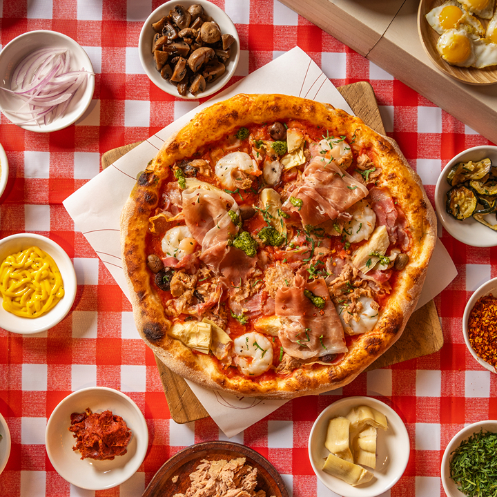 pizza surrounded by ingredients at The Pizza Project in Wan Chai and Central Hong Kong