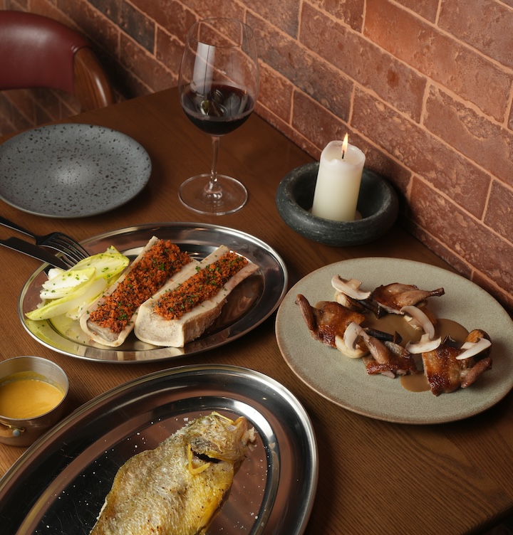 Group shot of dishes from Marrow pop-up restaurant in Hong Kong, including bone marrow infused dishes and yellow croaker