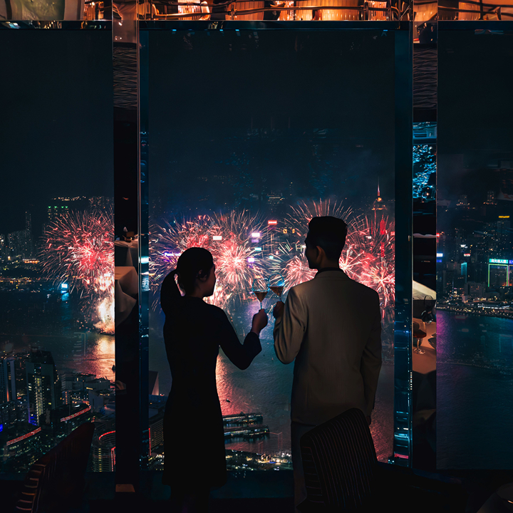 Couple watching the 2026 National Day fireworks in Hong Kong from Ozone in the Ritz-Carlton in Kowloon
