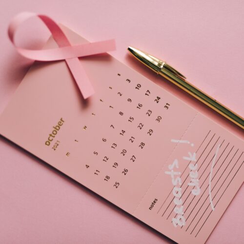 Pink ribbon with calendar promoting breast cancer awareness in October 2026